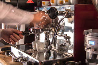 macchina caffè espresso e barista