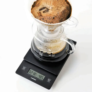 Bilancia timer HARIO V60 Drip Scale per un'estrazione del caffè precisa e costante. Perfetta per gli intenditori.